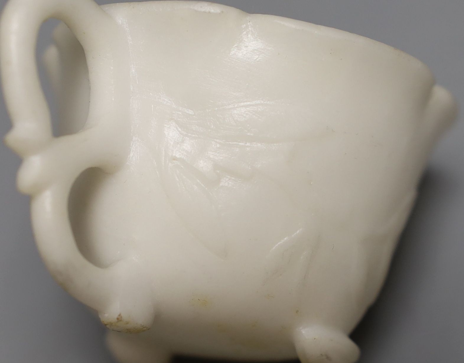 A White hardstone tea cup and saucer - 5cm tall